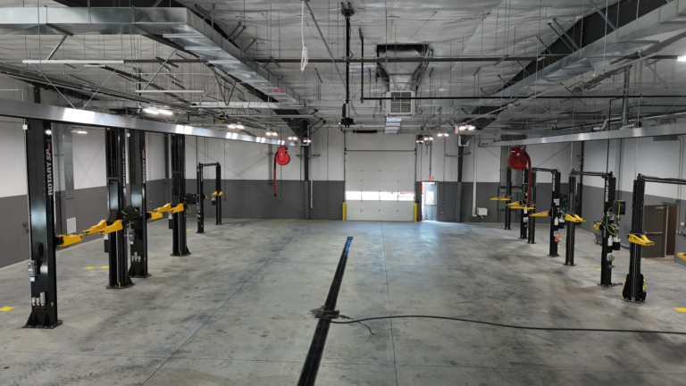 Commercial service bay wired by Adams Electric, with overhead lighting and conduit runs, Central Pennsylvania